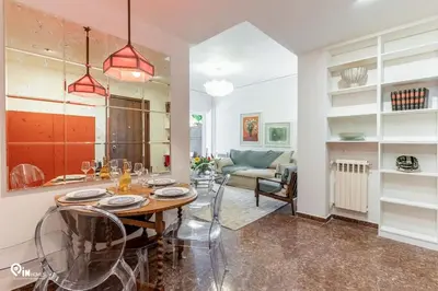 a kitchen and living room with a table and chairs at Hephaestus - Luxury & Modern Apartment in Psychiko in Athens