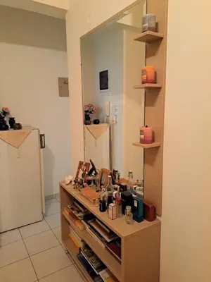 a dressing room with a large mirror on the wall at Minimal Stoudio in Athens