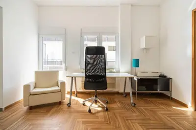 an office with a chair and a desk and a chair at Sunny southern Athens flat near the seaside in Athens