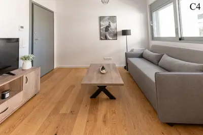 a living room with a couch and a coffee table at Waylink Residences - Marina Floisvou in Athens