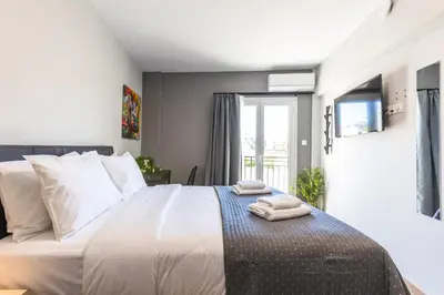 a bedroom with a bed with two towels on it at Raise Area 41 in Athens