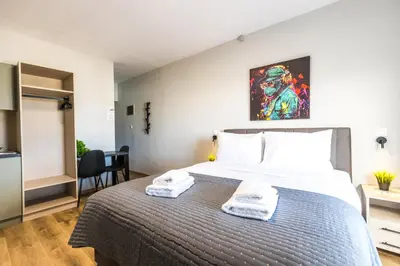 a bedroom with a bed with two towels on it at Raise Area 41 in Athens