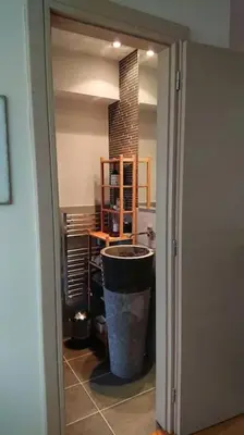 a hallway with a trash can in a room at Top roof luxury studio near metro! in Athens