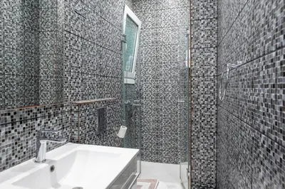 a bathroom with a sink and a mirror at Estia in Athens