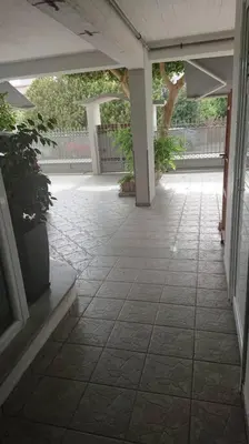 an empty patio with a potted plant in a building at Cozy ground floor studio near metro! in Athens
