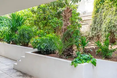 a bunch of trees and plants in a garden at Dousma Apartment in Athens