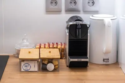 a toaster sitting on top of a counter with food at White & Stars in Athens