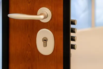 a close up of a wooden door with a handle at White & Stars in Athens