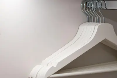 a white rack with a fork on a wall at White & Stars in Athens