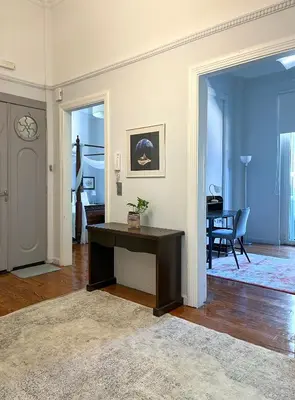 a living room with a desk and a table at Athens Center, Akadimias 77 - 1rst floor in Athens