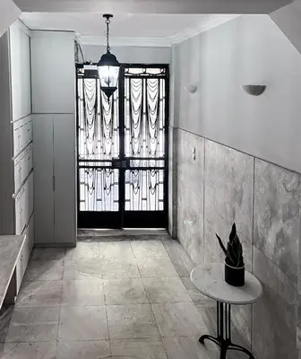 a room with a door with a table and a window at Athens Center, Akadimias 77 - 1rst floor in Athens
