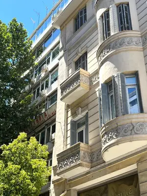 a building with balconies on the side of it at Athens Center, Akadimias 77 - 1rst floor in Athens