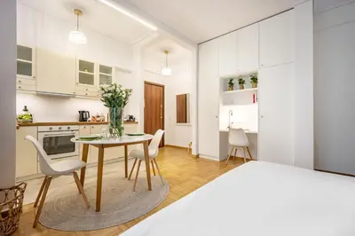 a kitchen and dining room with a table and chairs at Palm Athens by GK Properties in Athens