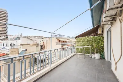 a balcony with a view of the city at Modern spacious apt in Athens in Athens