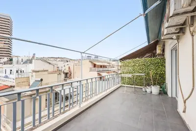 a balcony with a view of a city at Modern spacious apt in Athens in Athens