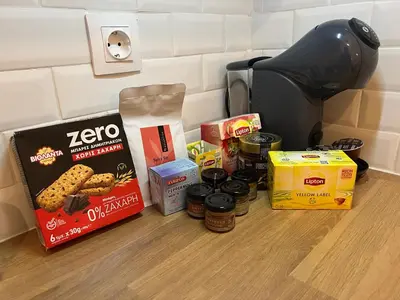a group of food items on a counter next to a coffee maker at Alice Museum Retreat in Athens