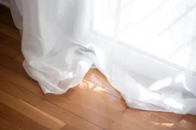 a close up of a wedding dress on a wooden floor at Eclectic Moonstone apartment in Athens in Athens