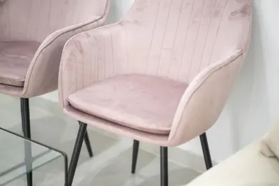 a pair of blush pink chairs against a wall at Eclectic Moonstone apartment in Athens in Athens