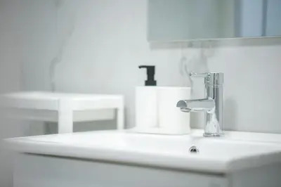 a bathroom sink with a faucet on it at Eclectic Moonstone apartment in Athens in Athens