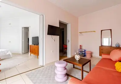 a living room with a couch and a table at Athens City Center Gem-Acropolis View-Bright Spacious Flat in Athens