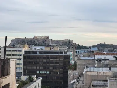 a view of the city from the roofs of buildings at Athens City Center Gem-Acropolis View-Bright Spacious Flat in Athens
