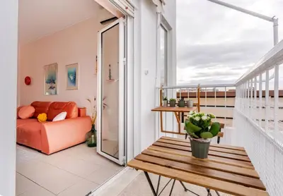 a balcony with a bench and a couch at Athens City Center Gem-Acropolis View-Bright Spacious Flat in Athens