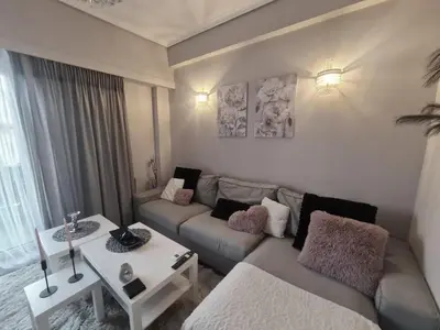 a living room with a couch and a table at akinitapanou in Athens