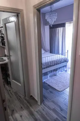 a bedroom with a bed and a mirror at akinitapanou in Athens