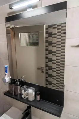 a bathroom with a sink and a mirror at akinitapanou in Athens