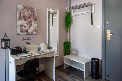 an office with a desk with a chair and a mirror at akinitapanou in Athens