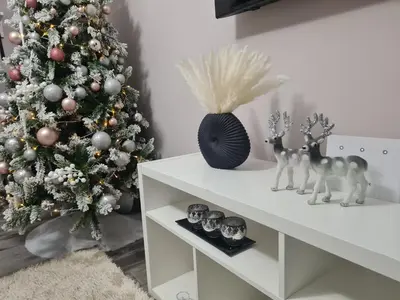 a white christmas room with a christmas tree and decorations at akinitapanou in Athens
