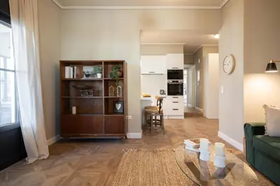 a living room with a couch and a table at Luxury Petralona Penthouse - Sleeps 7 -Near Metro in Athens