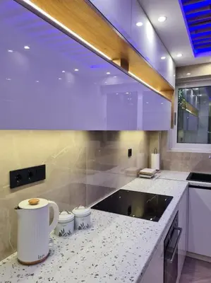 a kitchen with purple lighting and a counter top at Boho 3siblings in Athens