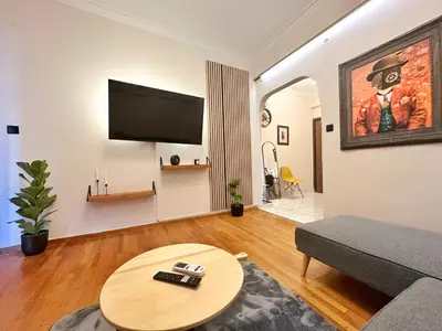 a living room with a couch and a table at St Tomas Square Apartment in Athens