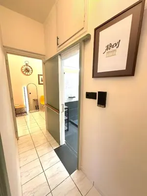 a hallway with a door leading into a room at St Tomas Square Apartment in Athens