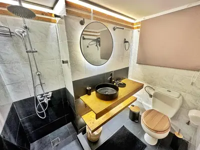 a bathroom with a sink and a toilet and a shower at St Tomas Square Apartment in Athens