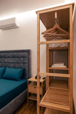 a room with a bunk bed and a book shelf at athens guest in Athens