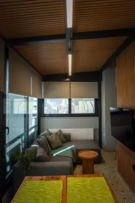a living room with a couch and a table at athens guest in Athens
