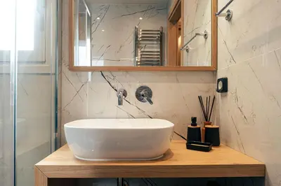 a bathroom with a white sink and a mirror at athens guest in Athens