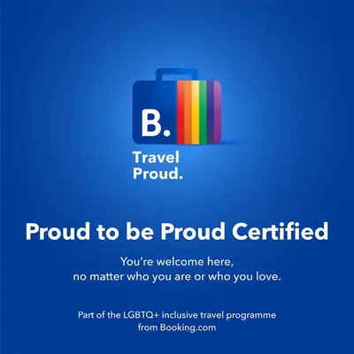 a sign that says proud to be proud certified with a suitcase at S-eva resort athens apartments in Athens