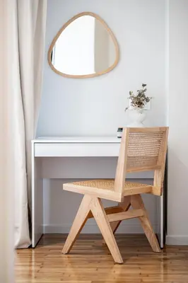 a wooden chair sitting at a desk with a mirror at Athens Horizon Suite by GK Properties in Athens