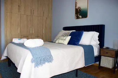 a bedroom with a bed with two pillows on it at Welcome to Elena's Athens Suite! in Athens