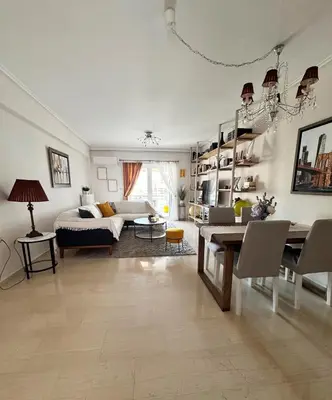 a living room with a bed and a dining table at Welcome to Elena's Athens Suite! in Athens