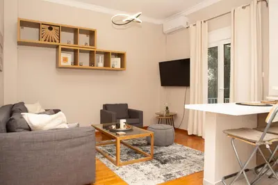 a living room with a couch and a table at P24 by SpitiSou in Athens