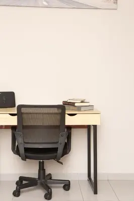 an office desk with a monitor and a chair at P24 by SpitiSou in Athens