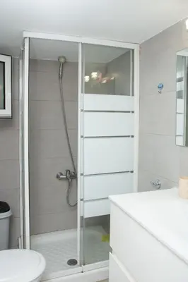 a bathroom with a shower and a toilet at P24 by SpitiSou in Athens
