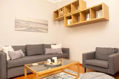 a living room with a couch and a table at P24 by SpitiSou in Athens