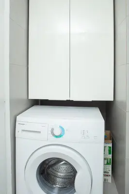 a white washer and dryer in a bathroom at P24 by SpitiSou in Athens