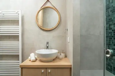 a bathroom with a sink and a mirror at Luxury apartment in Alimos in Athens