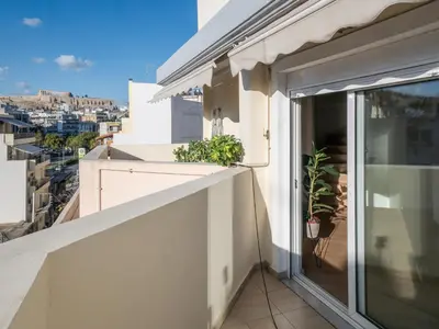 a balcony with a view of a city at Casa Acropolis - Stunning 3Br Apt with Private Terrace in Athens
